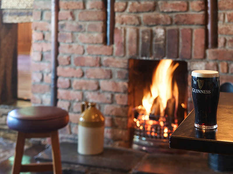 Cosy Fire And Pint McGrory's Bar Culdaff, Tourism Ireland By Richard Watson